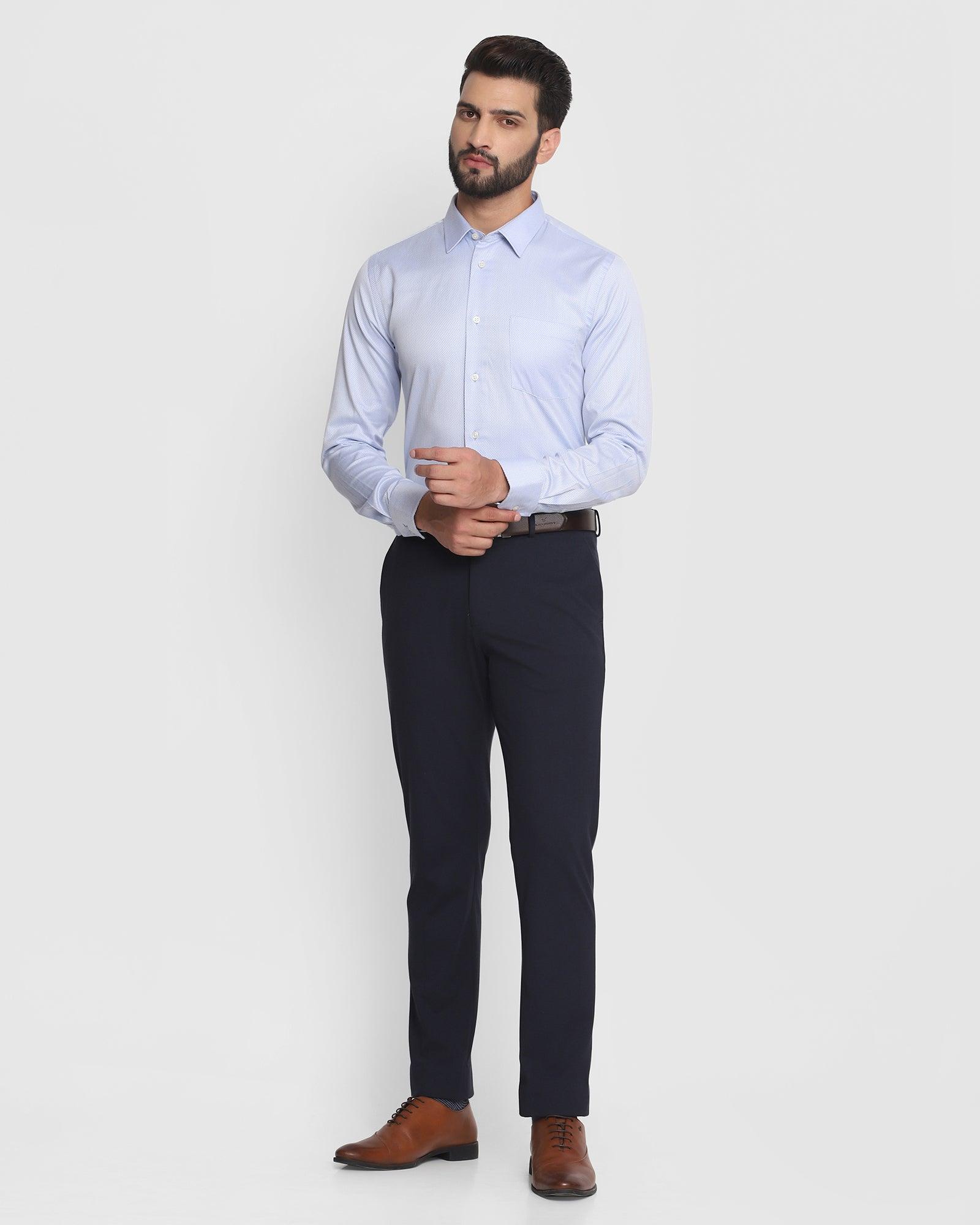 ai generated image of man wearing navy blue shirt with pink trousers -  AvenueSixty